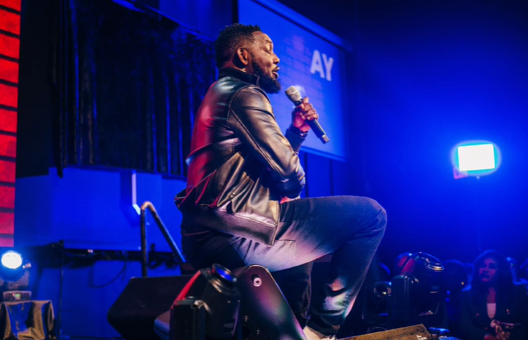 Ayodeji "AY" Makun during the performance of AY: Spotting the Difference [Instagram/@aycomedian]