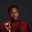 Ali Nuhu, holding an award.