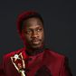 Ali Nuhu, holding an award.