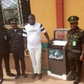 The ex-offender, Daniel Aturu with the Deputy Controller of Corrections, in charge of the Medium Security Custodial Centre, Owerri, Imo, Eke Eke and other senior staff of the Service [NAN]