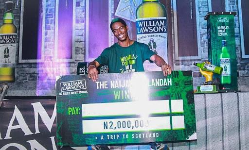 Winner, The Naija Highlandah Challenge 2022, Akinwale Awatt displaying his N2 million cheque and trophy at the Grand Finale of The NaijaHighlandah Challenge by William Lawson's held at Union Bank Sports Ground, Surulere, Lagos on Saturday November 12.