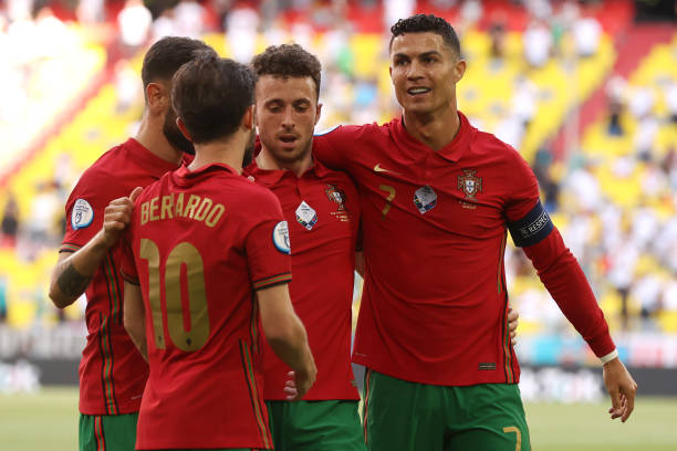 Cristiano Ronaldo of Portugal celebrates with Diogo Jota and Bernardo Silva after scoring their side's first goal during the UEFA Euro 2020 Championship Group F match between Portugal and Germany
