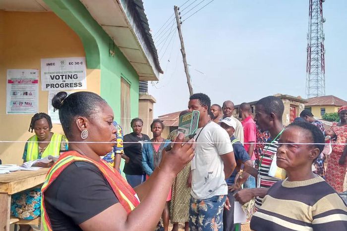 INEC officials attending to voters at a polling unit during the 2023 general elections. [Twitter:@inecnigeria]