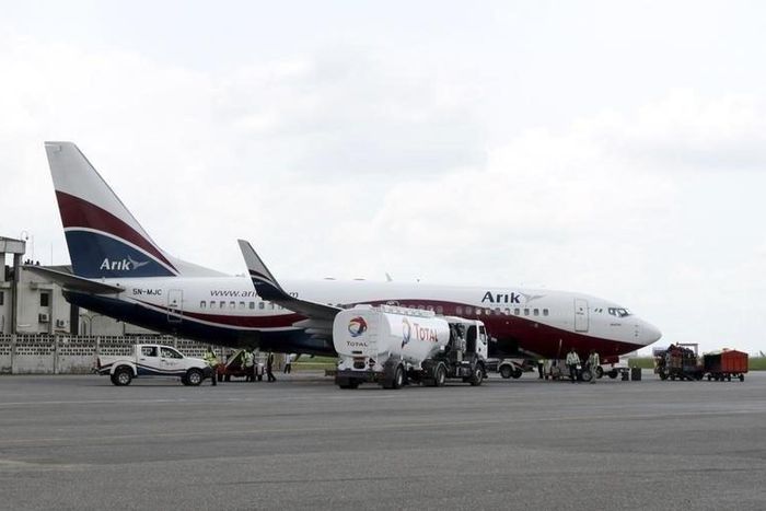 A Boeing 737-7BD Arik Air aeroplane is seen parked on the tarmac at the local airport in Lagos November 2, 2012. REUTERS/Akintunde Akinleye