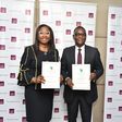 Managing Director, First City Monument Bank (FCMB), Mrs. Yemisi Edun with the Director General, Nigeria Country Department of the African Development Bank (AfDB), Mr. Lamin Barrow, during the signing ceremony of a $50 million Line of Credit Agreement p...
