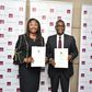 Managing Director, First City Monument Bank (FCMB), Mrs. Yemisi Edun with the Director General, Nigeria Country Department of the African Development Bank (AfDB), Mr. Lamin Barrow, during the signing ceremony of a $50 million Line of Credit Agreement p...