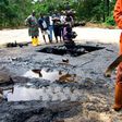 Workers subcontracted by Shell Oil Company clean up an oil spill from an abandoned Shell Petroleum Development Company well in Oloibiri, Niger Delta.