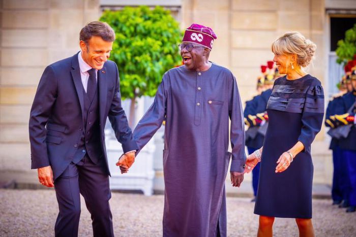President Bola Tinubu shares laugh with French President [Presidency]