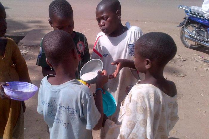 Almajiri children sharing food in the North