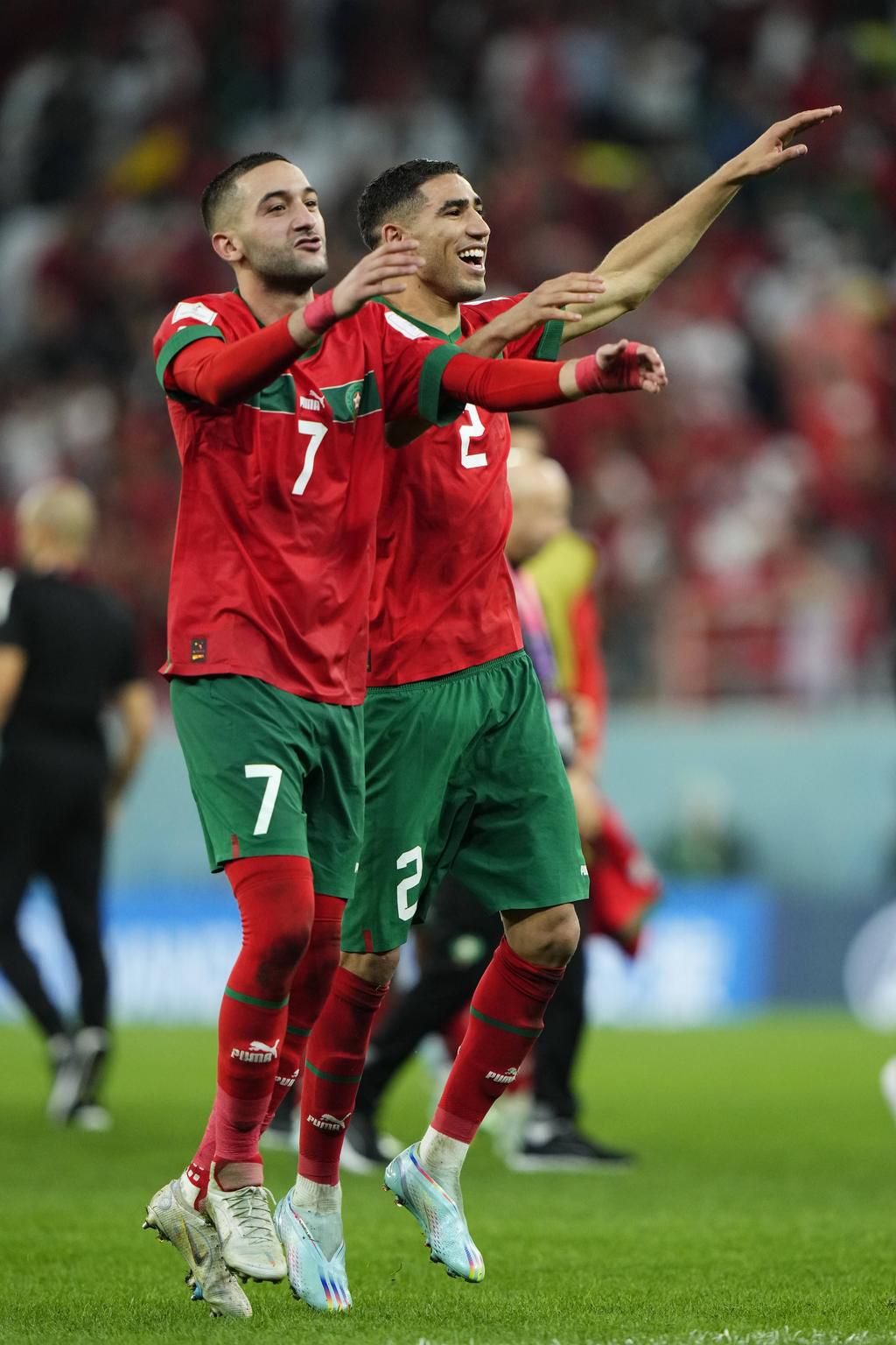 Hakim Ziyech (left) and Achraf Hakimi (right) of celebrate victory after the FIFA World Cup Qatar 2022 Round of 16 match between Morocco and Spain at Education City Stadium on December 6, 2022.