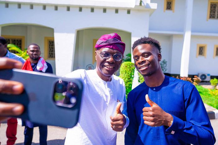 L-R: Gov. Babajide Sanwo-Olu of Lagos State and Arsenal Forward, Bukayo Saka take a selfie during a courtesy visit to the Governor, at the Lagos House, Marina, on Friday, June 3, 2023. [Twitter:Jagbros]