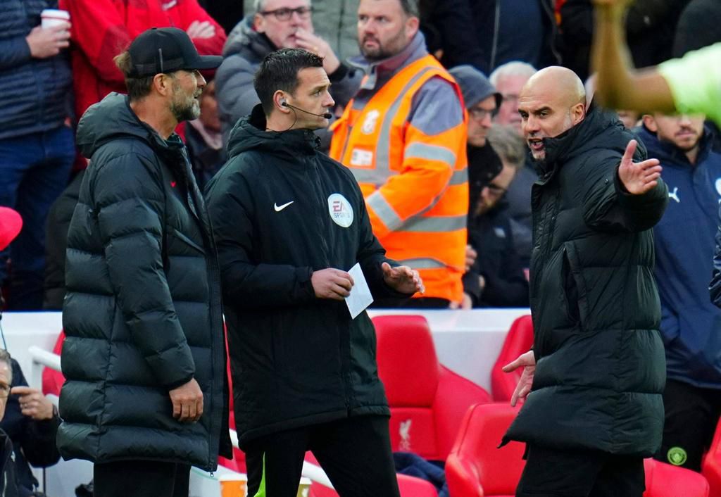 Liverpool Manager Jurgen Klopp and Manchester City manager Pep Guardiola react after a City goal was disallowed after a VAR check on October 16, 2022.