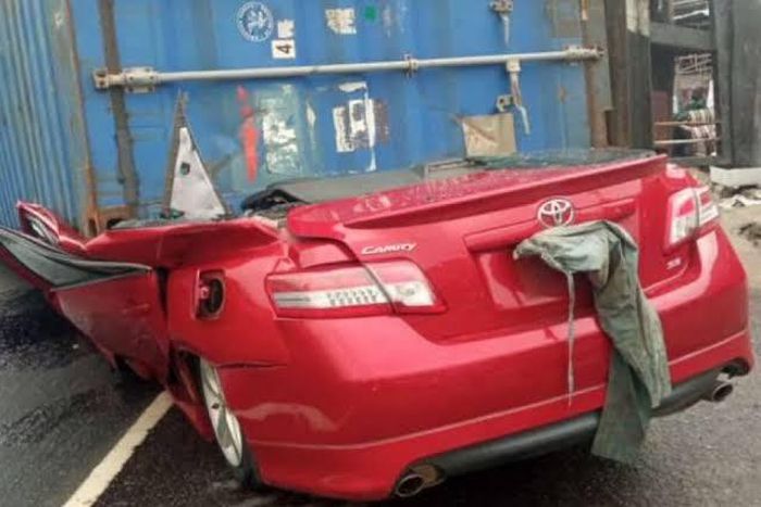 Truck carrying 40ft container falls on car in Lagos