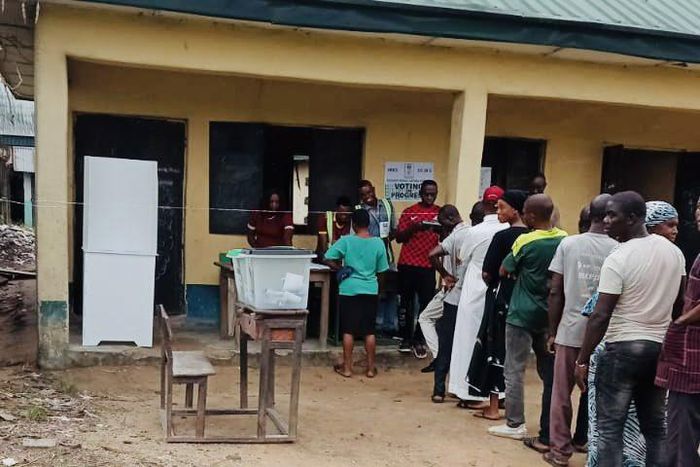 INEC officials attending to voters at a polling unit during the 2023 general elections. [Twitter:@inecnigeria]