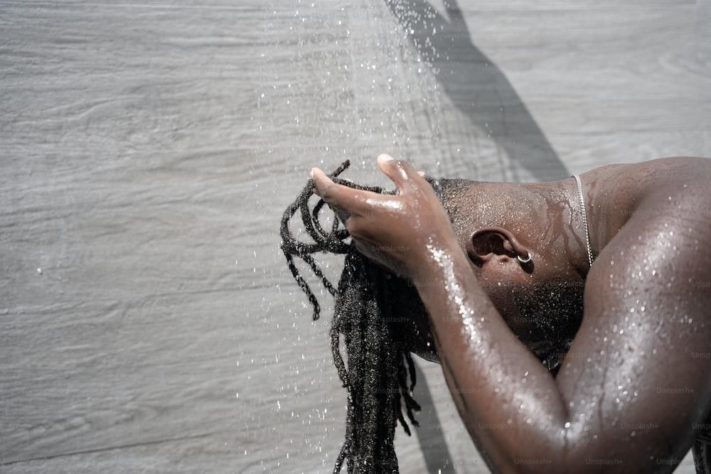 It's important to wash and clean dreadlocks [Unsplash]