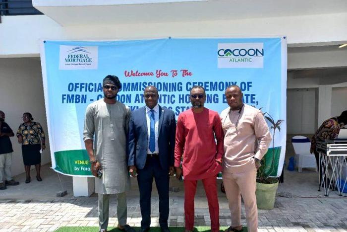 Representative of Managing Director, FMBN, Mr Ibrahim Nafada and some of the beneficiaries of the housing units.
