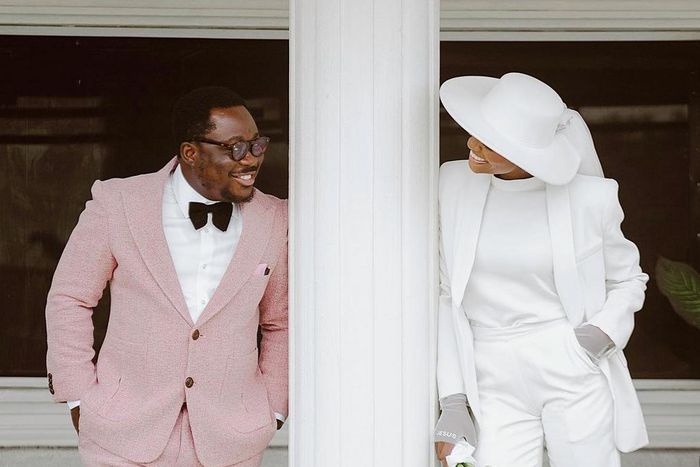 Temilade chose to wear a suit for her white wedding [Instagram/temiladesalami]