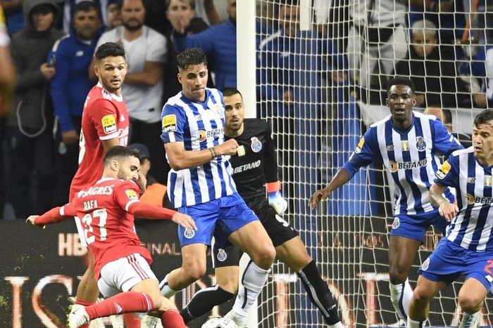 Nigeria's Zaidu Sanusi (second-right) watches on as Rafa Silva (left) shoots to score for Benfica against FC Porto