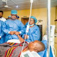 Gov. Dapo Abiodun holding the victim in Intensive Care Unit at Federal Medical Centre, Abeokuta. [Twitter:@dabiodunMFR