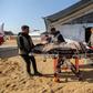 Patients receive treatment in a field hospital built by the International Medical Corps on January 16, 2024 in Rafah, Gaza.Ahmad Hasaballah/Getty Images