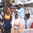 Nigerian evacuees with Chairman/ CEO of Nigerians in Diaspora Commission (NiDCOM) Abike Dabiri-Erewa (middle) during their evacuation back to Nigeria. [Guardian]
