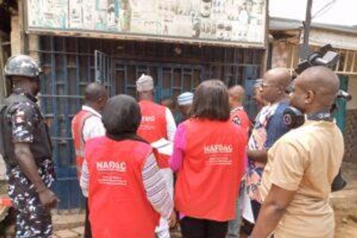 NAFDAC officials sealing a shop with unwholesome products in Suleja, Niger State.