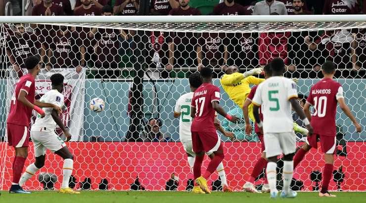 Famara Diedhiou heads in Senegal's second goal in their 2022 FIFA World Cup Group A game against Qatar