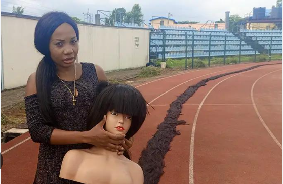 Helen laid out her extensive wig to be measured [LindaIkeji]
