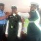 CP Idowu Owohunwa decorating promoted Insp. Ajara Isede of the Lagos Police Traffick Division on Thursday in Lagos. [(NAN]