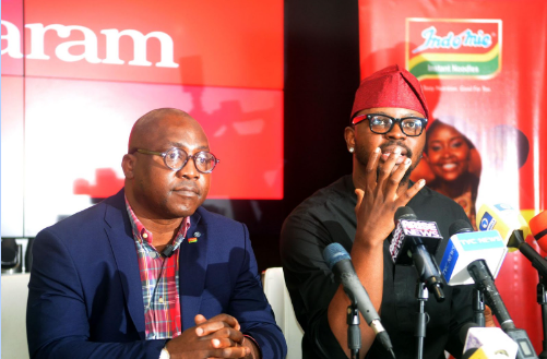 L-R: Group Corporate Communication and Events General Manager, Tolaram, Temitope Ashiwaju and new Guinness World Record holder for the world's largest painting by an individual, Dr. Fola David during a press conference at Tolaram head office in Suruler...