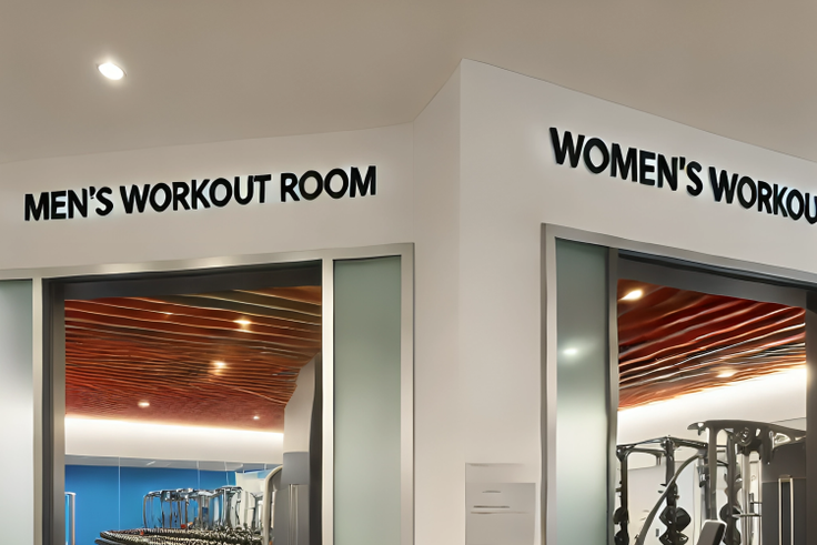 An AI-generated image of an Interior of a modern gym featuring separate workout rooms for men and women The gym is split into two distinct areas
