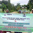 Some of the women farmers in Niger on Friday who benefitted from the Federal Government’s free rice seeds and rice kits displaying the items with a banner [NAN]