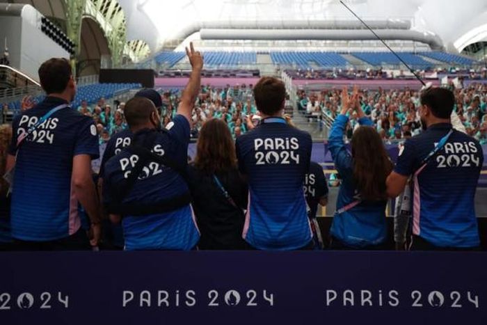 Paris Olympics volunteers already selling their uniforms online [s.yimg]