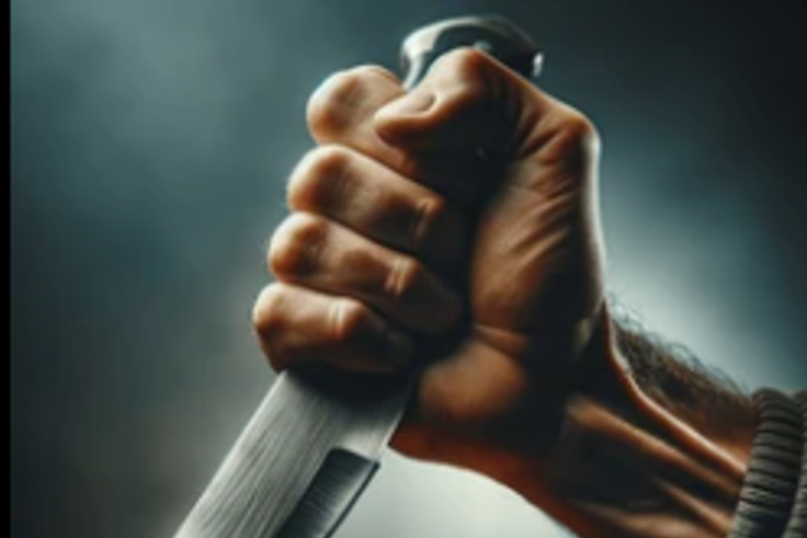 Hand holding a knife [Shutterstock]