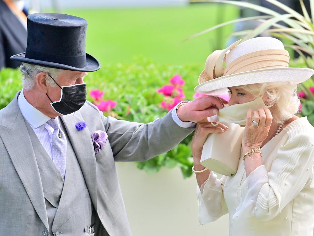 2021: Charles and Camilla selected a candid photo that highlighted precautions the nation took against COVID-19.