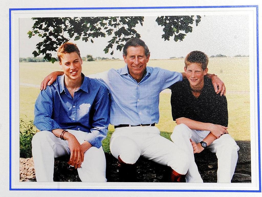 1999: Charles put his arms around his sons in this photo on the front of his 1999 Christmas card.