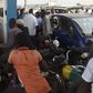 People queue to buy fuel at a petrol station in Lagos, southwest Nigeria. [Getty Images]
