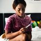 Woman holding pregnancy test(Rawpixel)