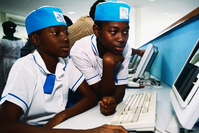 Some Nigerian secondary school students working on a computer. [Getty Images]