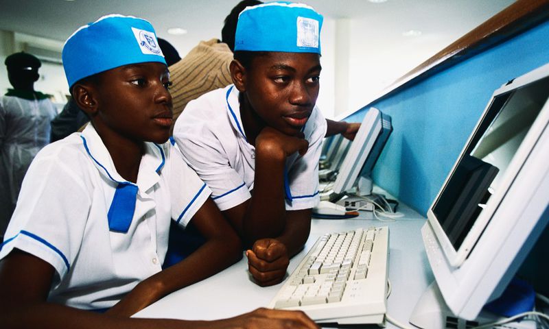 Some Nigerian secondary school students working on a computer. [Getty Images]