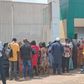 Nigerians waiting at National Agricultural Insurance Corporation at the Central Area in Abuja to buy government subsidised bags of rice [NAN]