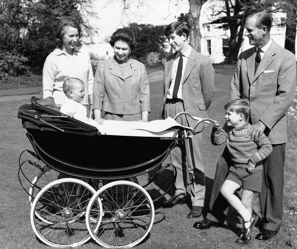 1965: Members of the royal family delight over 1-year-old Prince Edward in this image taken at Windsor Castle.