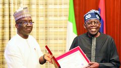 Edo Governor-elect, Mr Monday Okpebholo presenting his certificate of return to President Bola Tinubu at the Presidential Villa on Thursday [Presidency]