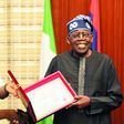 Edo Governor-elect, Mr Monday Okpebholo presenting his certificate of return to President Bola Tinubu at the Presidential Villa on Thursday [Presidency]