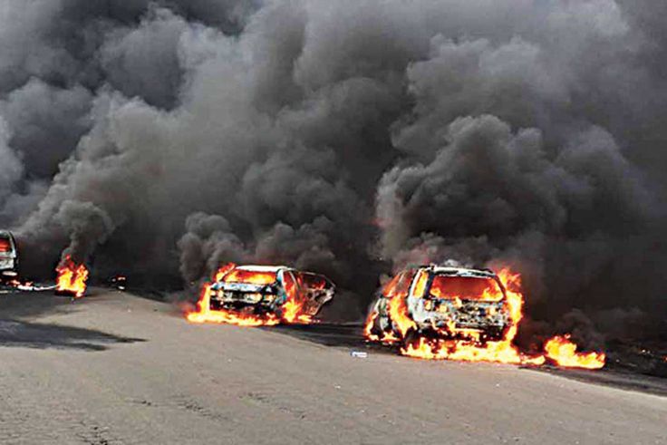An image shows the devastation from a petrol tanker explosion.
