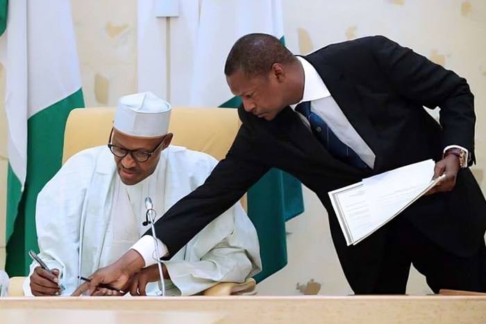 L-R: Former President Muhammadu Buhari and former AGF Abubakar Malami. [PremiumTimes]