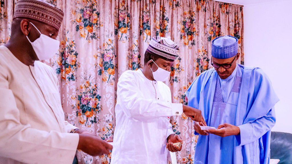 Bashir Hadejia and the then-Governor of Zamfara, Bello Matawalle displaying bars of gold to former President Muhammadu Buhari. [Bashir Ahmad/X]