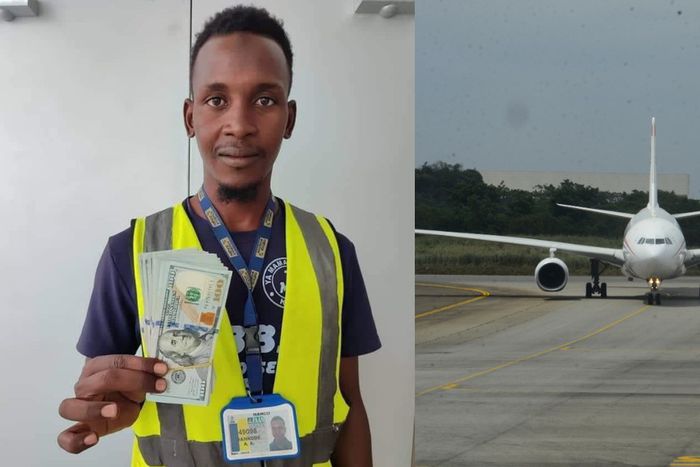 Auwal Dankode, a cleaner at Malam Aminu Kano International Airport in Kano displaying the dollar notes he found inside the plane. [Getty Images/X]