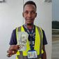 Auwal Dankode, a cleaner at Malam Aminu Kano International Airport in Kano displaying the dollar notes he found inside the plane. [Getty Images/X]