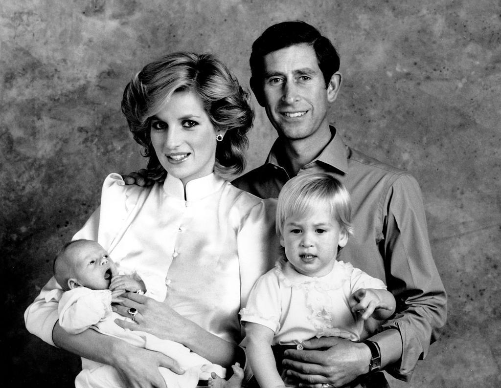 1984: An image from this family photo shoot was used for Charles and Diana's 1984 Christmas card. It shows Diana holding a newborn Prince Harry.